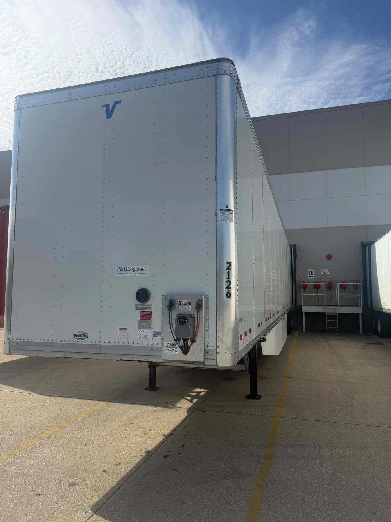 P&G Logistics dry van trailer at a loading dock